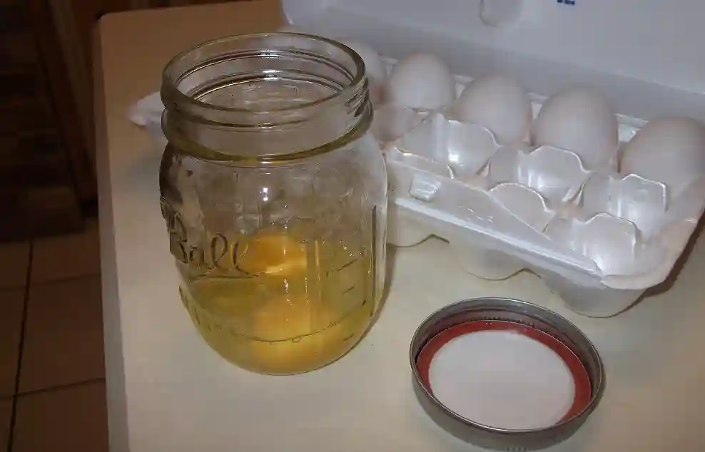 Precrack Eggs into a Water Bottle or Mason Jar