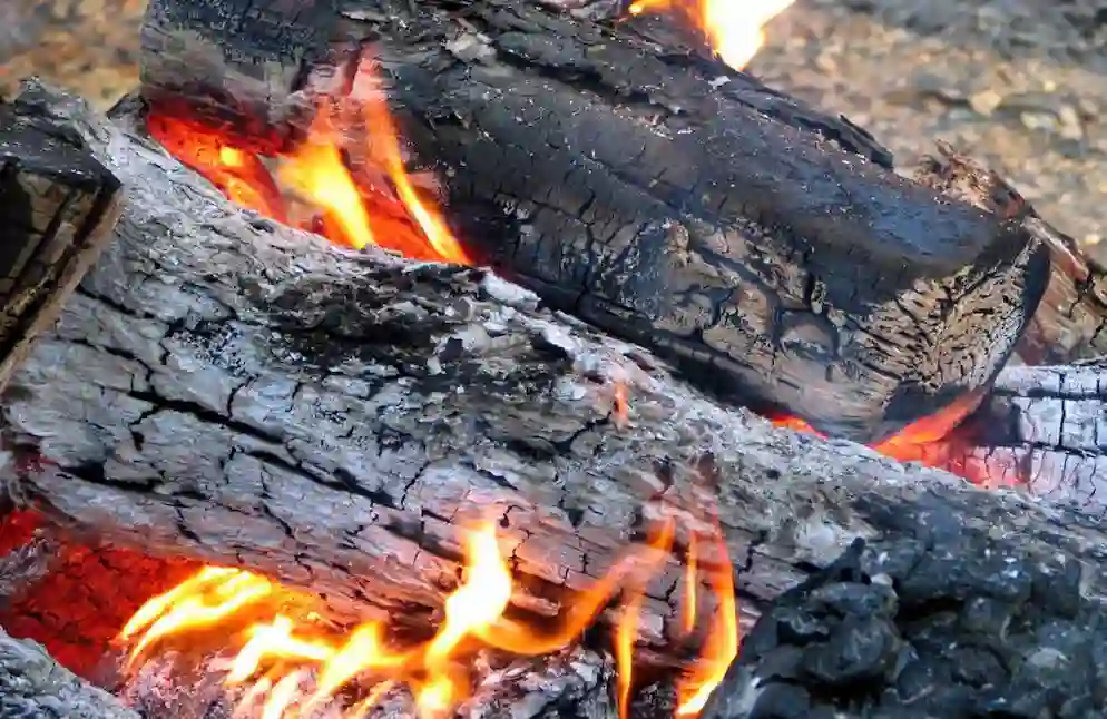 How to Make a Fire Burn Hotter Safely